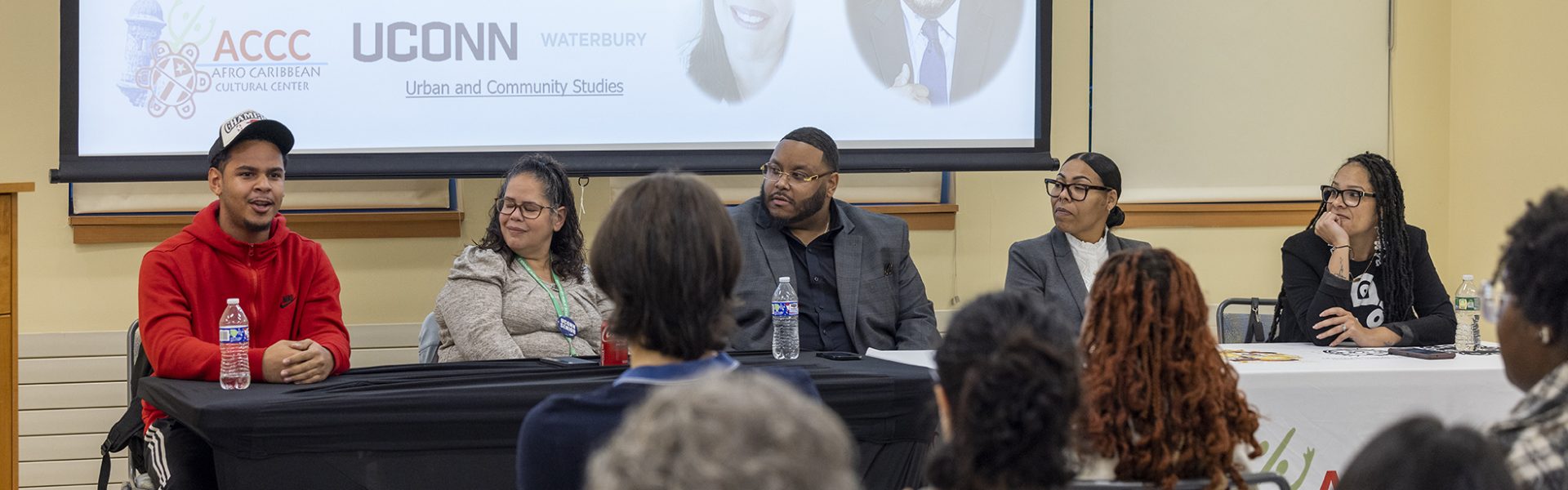 A photo of the UConn Waterbury Afro Latino Panel during a presentation in the Urban and Community Studies class.