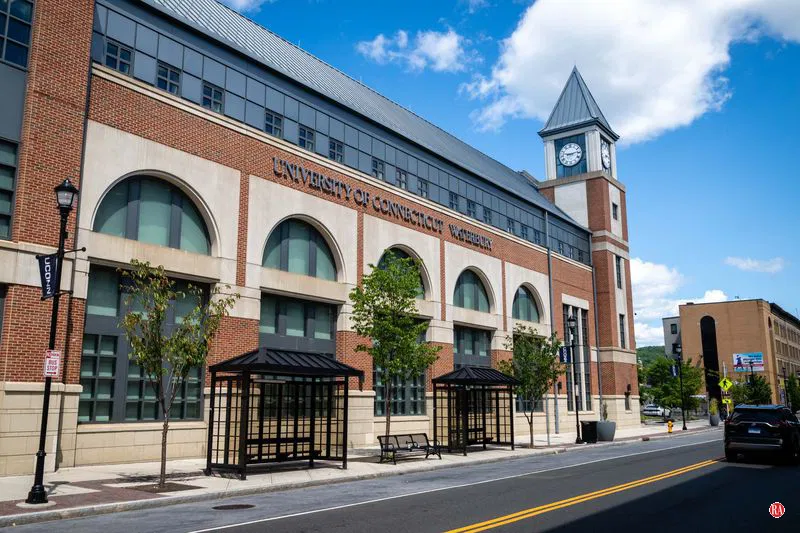 A photo of the University of Connecitcut Waterbury Building. The clock tower of the building is visible.