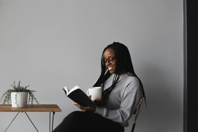 Photo of African American woman reading by Alexandra Fuller on Unsplash